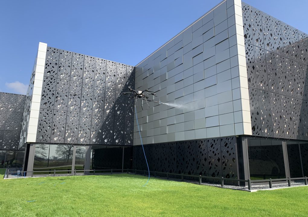 Bandi Drones setup to clean metal facade in an urban area in lagos Nigeria